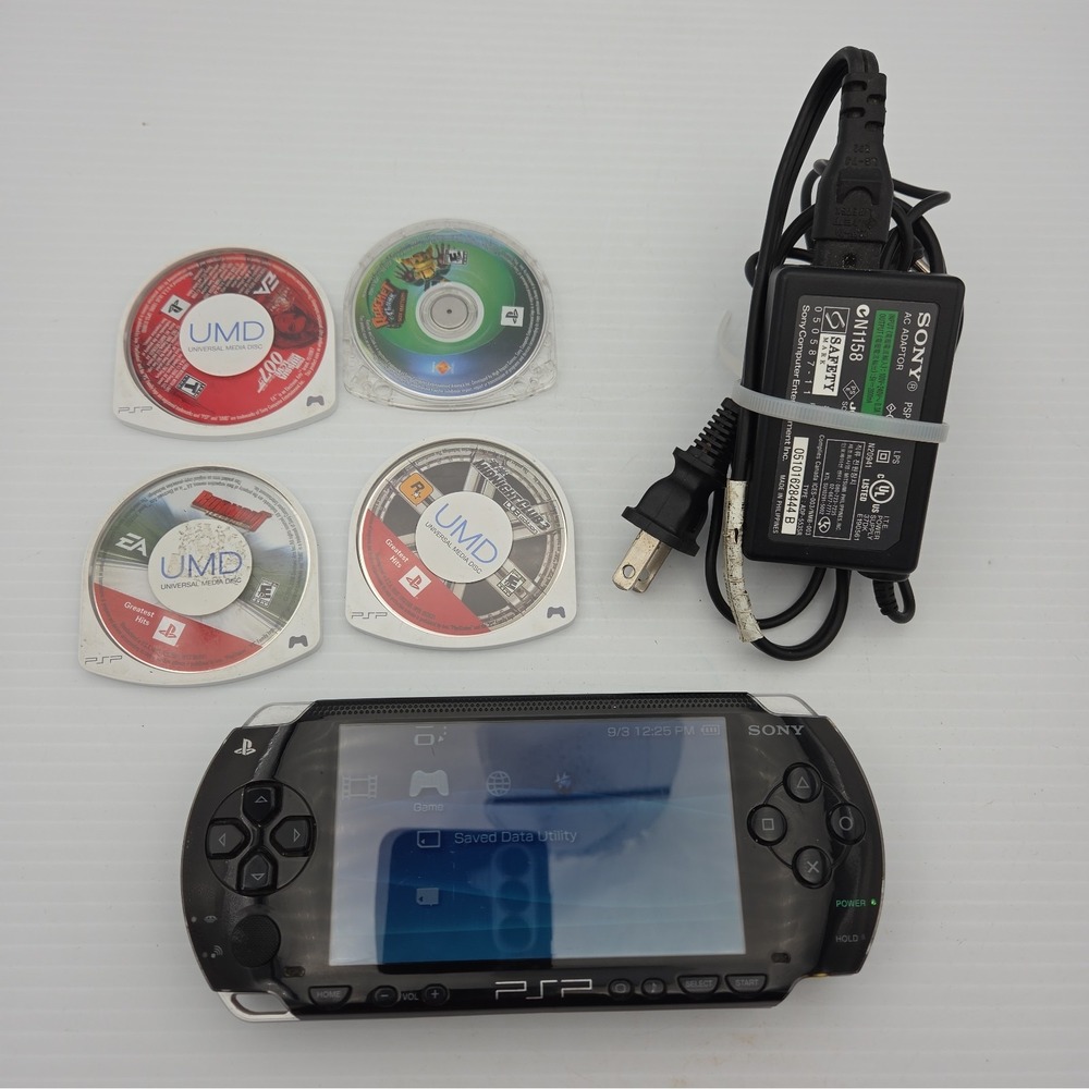 Sony PSP-1001 Black Console With Charger And 4 Games